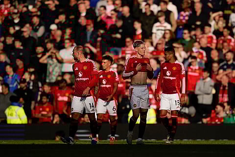 EPL 2024-25: Manchester United's players react after Brentford's Ethan Pinnock scoring his side's opening goal