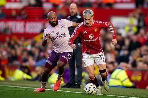 EPL 2024-25: Manchester United's Alejandro Garnacho, right, duels for the ball with Brentford's Bryan Mbeumo