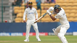 AP Photo/Aijaz Rahi : New Zealand's Rachin Ravindra plays a shot during day five of the first cricket test match between India and New Zealand at the M.Chinnaswamy Stadium, in Bengaluru.