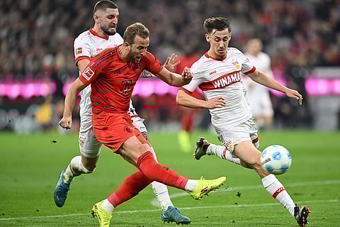 Bundesliga 2024-25: Munich's Harry Kane, left, plays against Stuttgart's Jeff Chabot