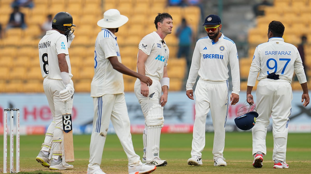 New Zealands Will Young, centre, interacts with Indian players. AP Photo
