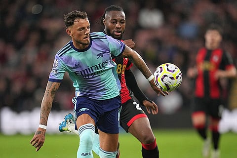 EPL 2024-25: Arsenal's Ben White, left, challenges for the ball with Bournemouth's Antoine Semenyo
