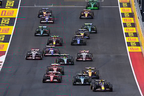 F1 US Grand Prix Auto Racing: Red Bull driver Max Verstappen, of the Netherlands, leads the pack into turn one