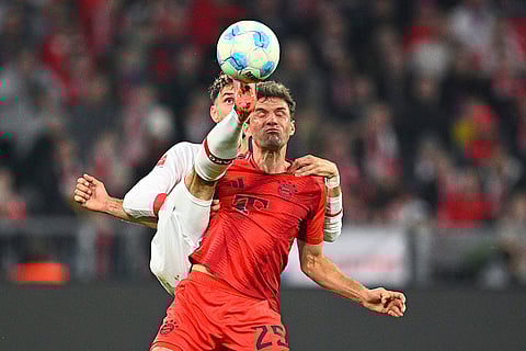 Bundesliga 2024-25: Stuttgart's Atakan Karazor, left, and Munich's Thomas Muller battle for the ball
