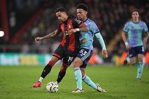 EPL 2024-25: Bournemouth's Justin Kluivert, left, challenges for the ball with Arsenal's Ethan Nwaneri