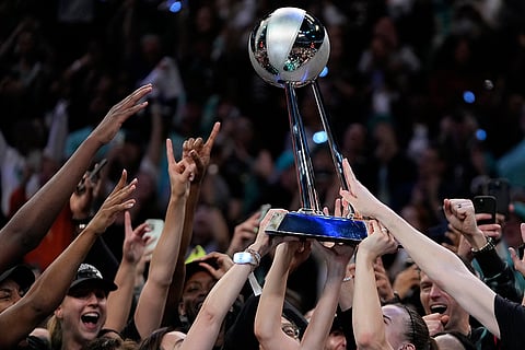 WNBA Finals: The New York Liberty hold up the championship trophy