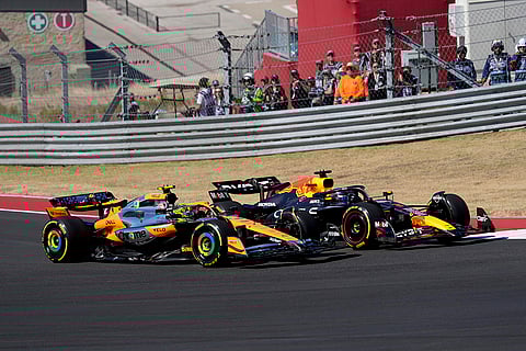 U.S. Grand Prix: McLaren driver Lando Norris, left, and Red Bull driver Max Verstappen race through a turn