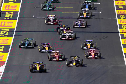 U.S. Grand Prix: McLaren driver Lando Norris, left front, of Britain leads the race