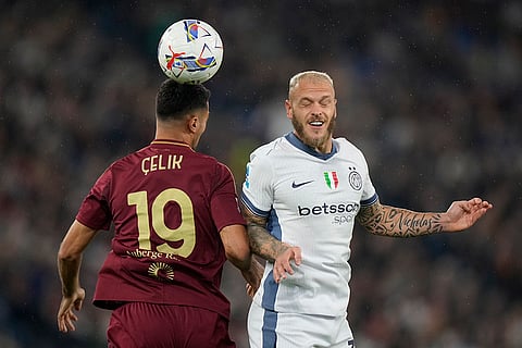 Serie A 2024-25: Roma's Zeki Celik, left, and Inter Milan's Federico Dimarco challenge for the ball