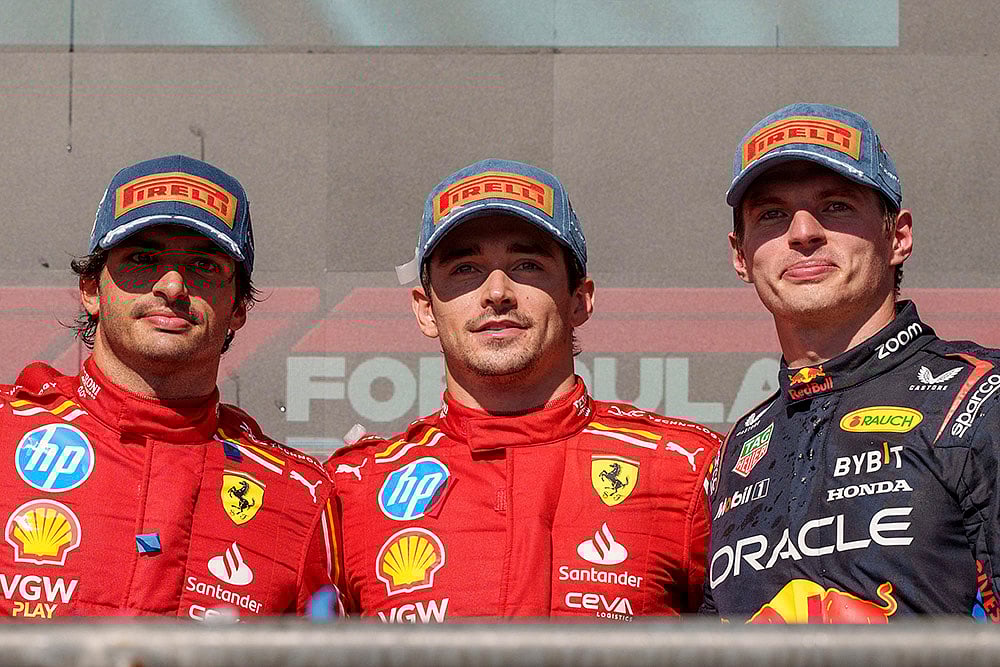 | Photo: AP/Nick Didlick : U.S. Grand Prix: Ferrari drivers Carlos Sainz, from left, who finished in second stands by race winner and teammate Charles Leclerc and Red Bull driver Max Verstappen