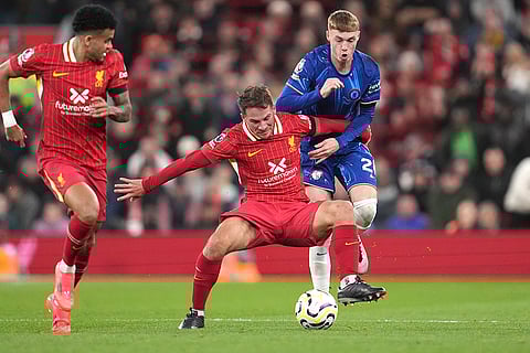 EPL 2024-25: Liverpool's Alexis Mac Allister, centre, challenges for the ball with Chelsea's Cole Palmer