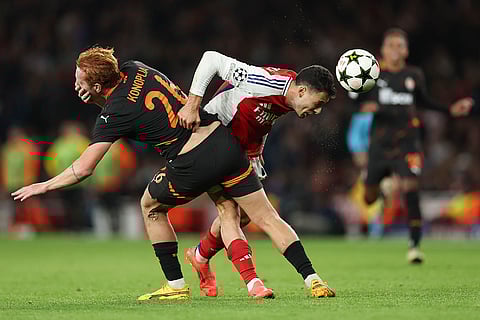 Champions League 2024-25: Shakhtar's Yukhym Konoplya, left, duels for the ball with Arsenal's Gabriel Martinelli