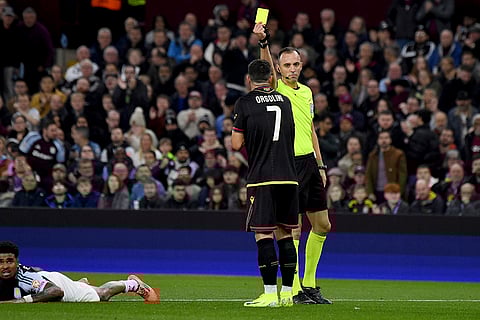 Champions League 2024-25: Bologna's Riccardo Orsolini, center, receives a yellow card