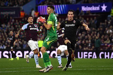 Champions League 2024-25: Aston Villa's goalkeeper Emiliano Martinez, center, makes a save
