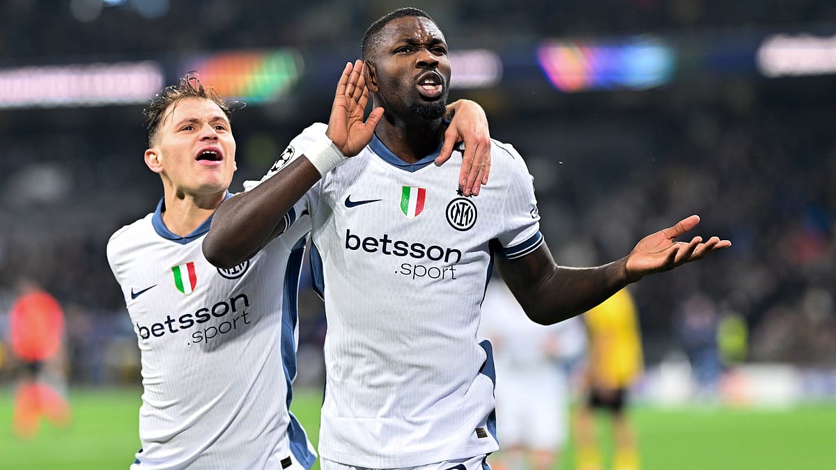 Nicolo Barella and Marcus Thuram celebrate the latter's winning goal.