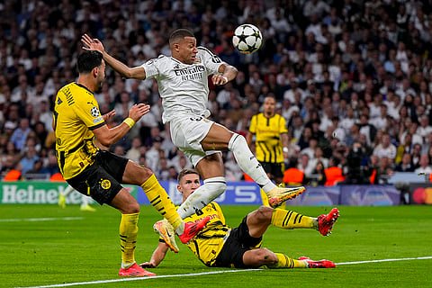Champions League 2024-25: Real Madrid's Kylian Mbappe fights for the ball with Dortmund's Ramy Bensebaini