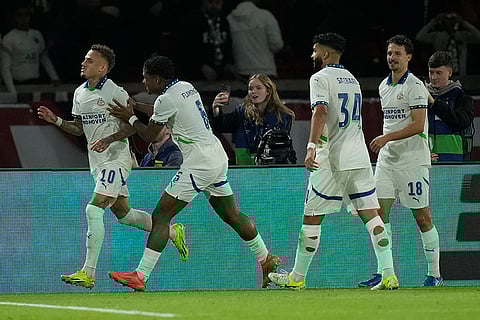 Champions League 2024-25: PSV's Noa Lang, left, celebrates with teammates after scoring his side opening goal
