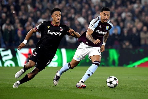 Champions League 2024-25: Aston Villa's Morgan Rogers, right, fights for the ball against Bologna's Dan Ndoye
