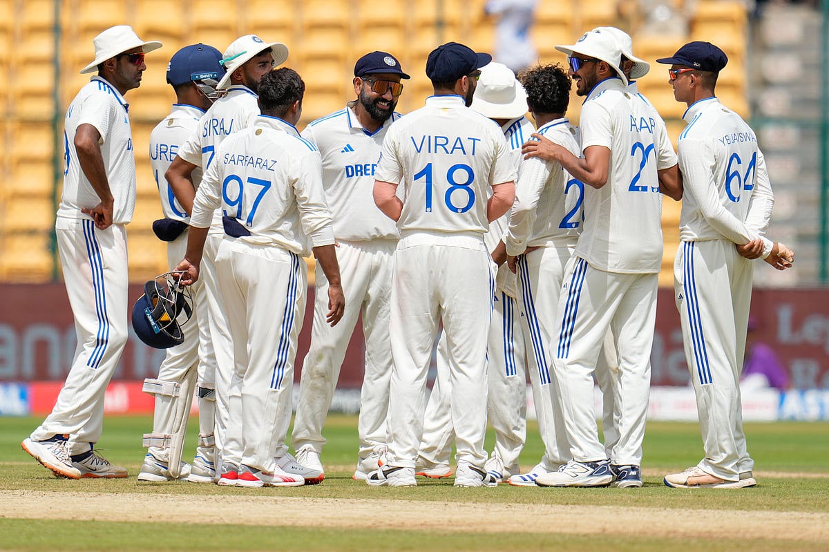 (AP Photo/Aijaz Rahi) : India's captain Rohit Sharma, fifth left, and teammates celebrate the dismissal of New Zealand's Ajaz Patel during the day three of the first cricket test match between India and New Zealand at the M.Chinnaswamy Stadium, in Bengaluru, India, Friday, Oct. 18, 2024. 