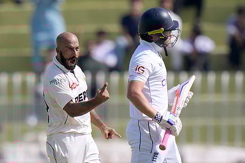Pakistan vs England 3rd Test: Pakistan's Sajid Khan, left, celebrates after taking the wicket of England's Ollie Pope