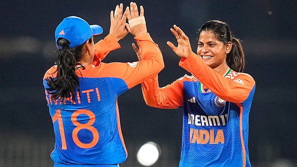 | Photo: PTI/R Senthilkumar : Radha Yadav celebrates with Smriti Mandhana 