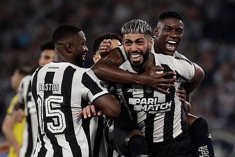 Copa Libertadores, SF 1st Leg: Alexander Barboza of Brazil's Botafogo, right, celebrates with teammates after scoring his side's second goal