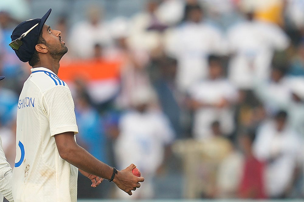 | Photo: AP/Rafiq Maqbool : India Vs New Zealand 2nd Test: India's Washington Sundar hold ball at the end of the New Zealand innings 