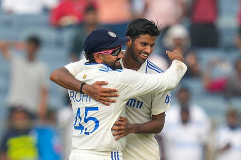 India Vs New Zealand 2nd Test: India's Washington Sundar, right, and India's captain Rohit Sharma celebrates the dismissal of New Zealand's Tim Southee