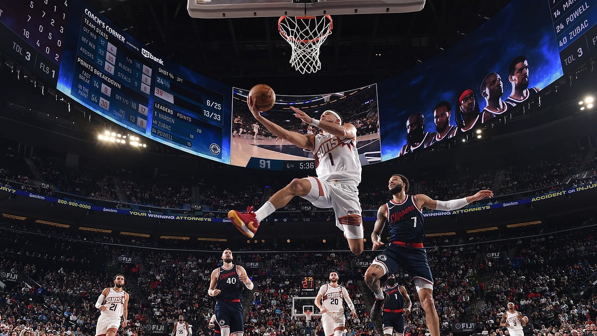 Devin Booker #1 of the Phoenix Suns drives to the basket during the game against the LA Clippers on October 23, 2024 at Intuit Dome in Los Angeles, California.
