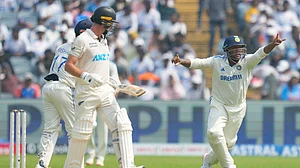 AP Photo/Rafiq Maqbool : India's Sarfaraz Khan, right, appeals for the wicket of New Zealand's Will Young, left, during day one of the second cricket test match between India and New Zealand at the Maharashtra Cricket Association Stadium, in Pune.