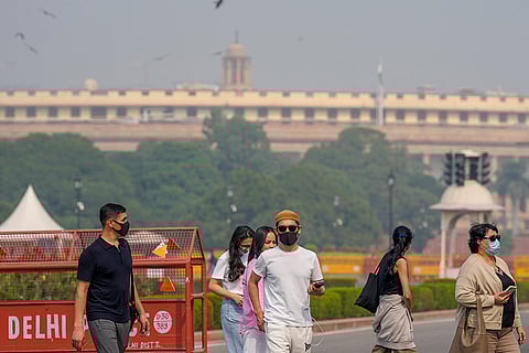 Foreign tourists wearing face masks in Delhi