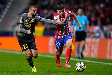 Champions League 2024-25: Lille's Edon Zhegrova, left, challenges Atletico Madrid's Javi Galan