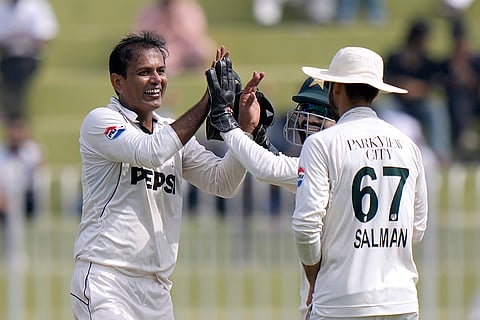 Pakistan vs England 3rd Test: Pakistan's Noman Ali, left, celebrates with teammates after taking the wicket of England's Ben Duckett