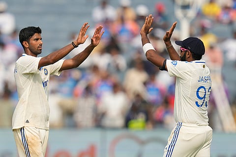 India Vs New Zealand 2nd Test: India's Washington Sundar, left, and Jasprit Bumrah celebrates the dismissal of New Zealand's Glenn Philips