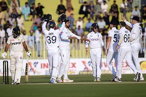 Pakistan vs England 3rd Test: England's Shoaib Bashir, center, celebrates with teammates after taking the wicket of Pakistan's Abdullah Shafique