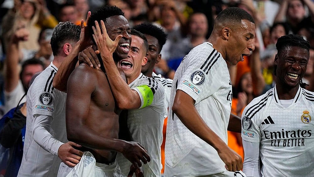 Champions League 2024-25: Real Madrid's Vinicius Junior, left, celebrates with teammates after scoring his side's fourth goal  - | Photo: AP/Manu Fernandez