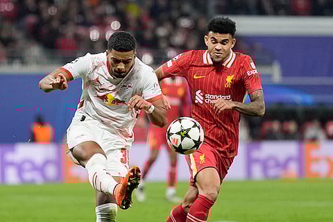Champions League 2024-25: Leipzig's Benjamin Henrichs, left, duels for the ball with Liverpool's Luis Diaz