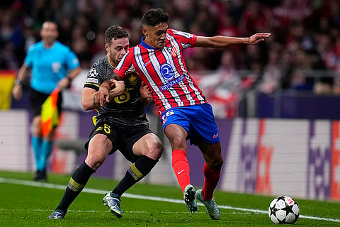 Champions League 2024-25: Lille's Gabriel Gudmundsson, left, challenges Atletico Madrid's Nahuel Molina