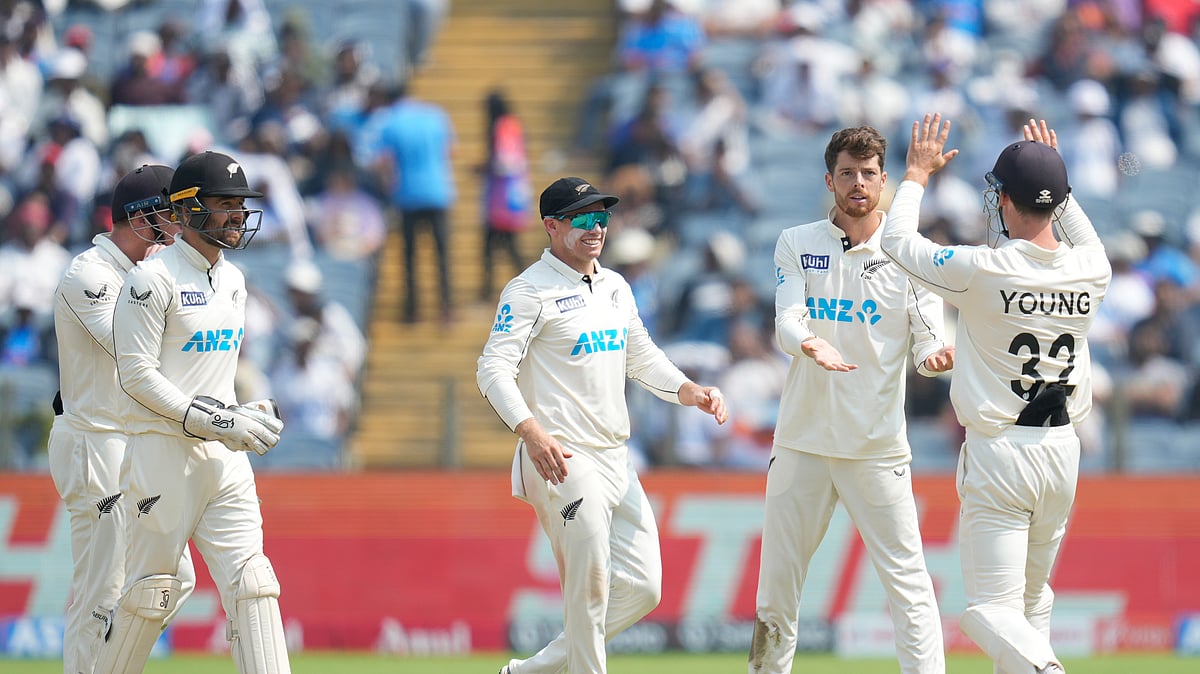 New Zealands Mitchell Santner, second from right, celebrates. AP Photo