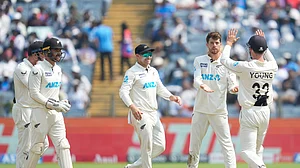 AP Photo/Rafiq Maqbool : New Zealand's Mitchell Santner, second from right, celebrates the dismissal of India's Ravichandran Ashwin with his teammates during day two of the second cricket test match between India and New Zealand at the Maharashtra Cricket Association Stadium,.