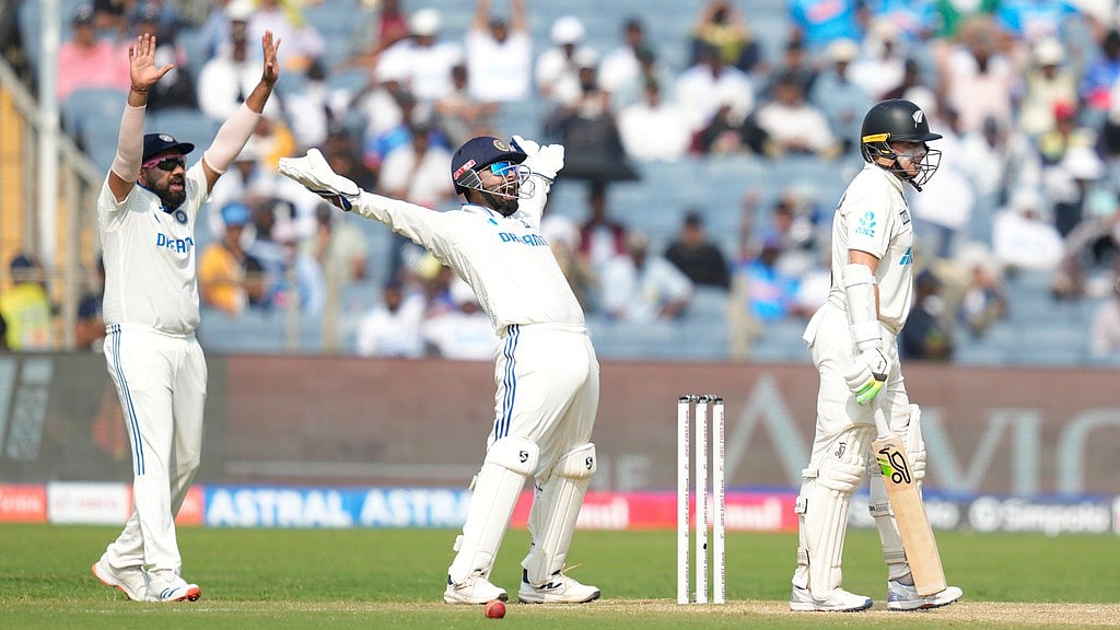 AP : Rohit Sharma, left, and India's Rishabh Pant , centre, appeals unsuccessfully for the wicket of New Zealand's captain Tom Latham, right, during the day two of the second cricket test match between India and New Zealand