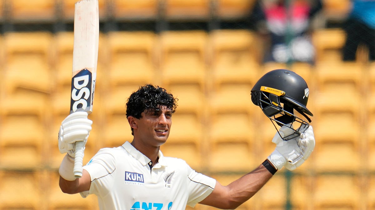 New Zealand's Rachin Ravindra celebrates after scoring a century during the day three of the first cricket test match between India and New Zealand at the M.Chinnaswamy Stadium, in Bengaluru, India, Friday, Oct. 18, 2024.  - (AP Photo/Aijaz Rahi)