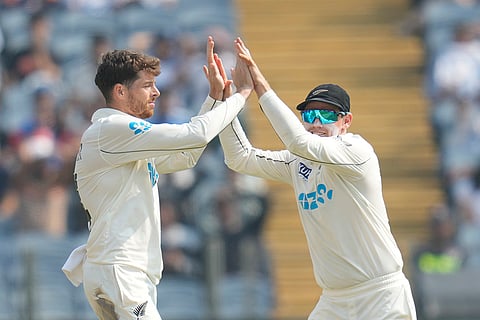 India Vs New Zealand 2nd Test: New Zealand's Mitchell Santner, left, and New Zealand's captain Tom Latham celebrates the dismissal of India's Virat Kohli