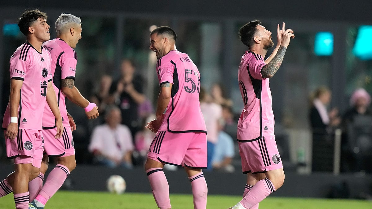 Inter Miami forward Lionel Messi, right, reacts after scoring his third goal for a hat trick during the second half of an MLS soccer match against the New England Revolution. - AP Photo/Lynne Sladky