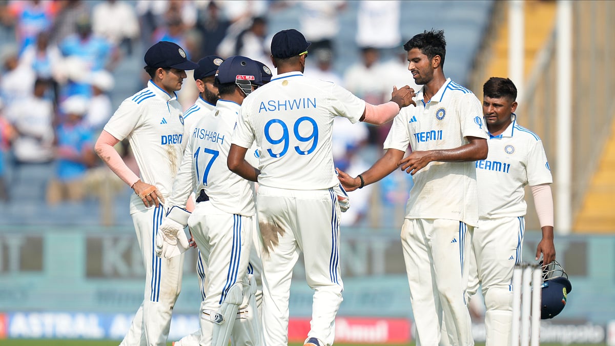 Indias Washington Sundar celebrates the dismissal of New Zealands Daryl Mitchell. AP Photo