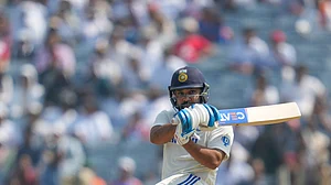 AP Photo/Rafiq Maqbool : India's captain Rohit Sharma plays a shot during day three of the second cricket test match between India and New Zealand at the Maharashtra Cricket Association Stadium, in Pune.