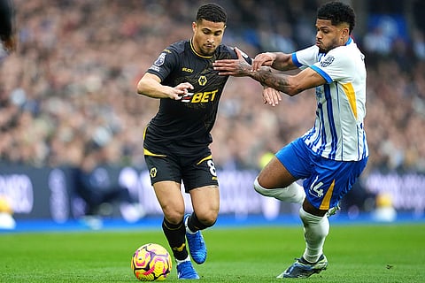 EPL 2024-25: Wolverhampton Wanderers' Joao Gomes, left and Brighton's Georginio Rutter vie for the ball