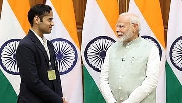 X/ArjunErigaisi : Arjun Erigaisi with Narendra Modi.