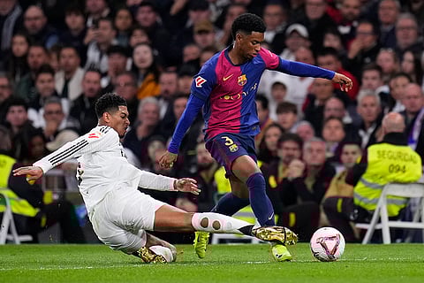La Liga 2024-25: Barcelona's Alejandro Balde is challenged by Real Madrid's Jude Bellingham
