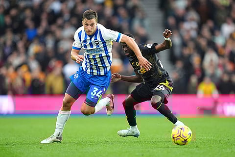 EPL 2024-25: Brighton's Joel Veltman, left and Wolverhampton Wanderers' Carlos Forbs vie for the ball